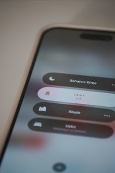Close-up of a smartphone screen displaying app interface with text in Turkish.